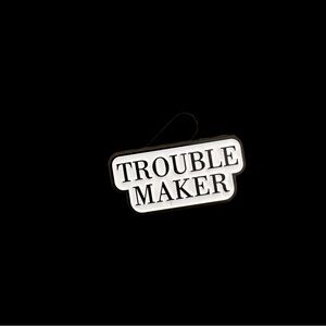 Troublemaker Enamel Pin – Bold Monochrome Statement Accessory